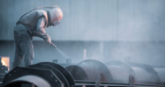 Worker cleaning with snow